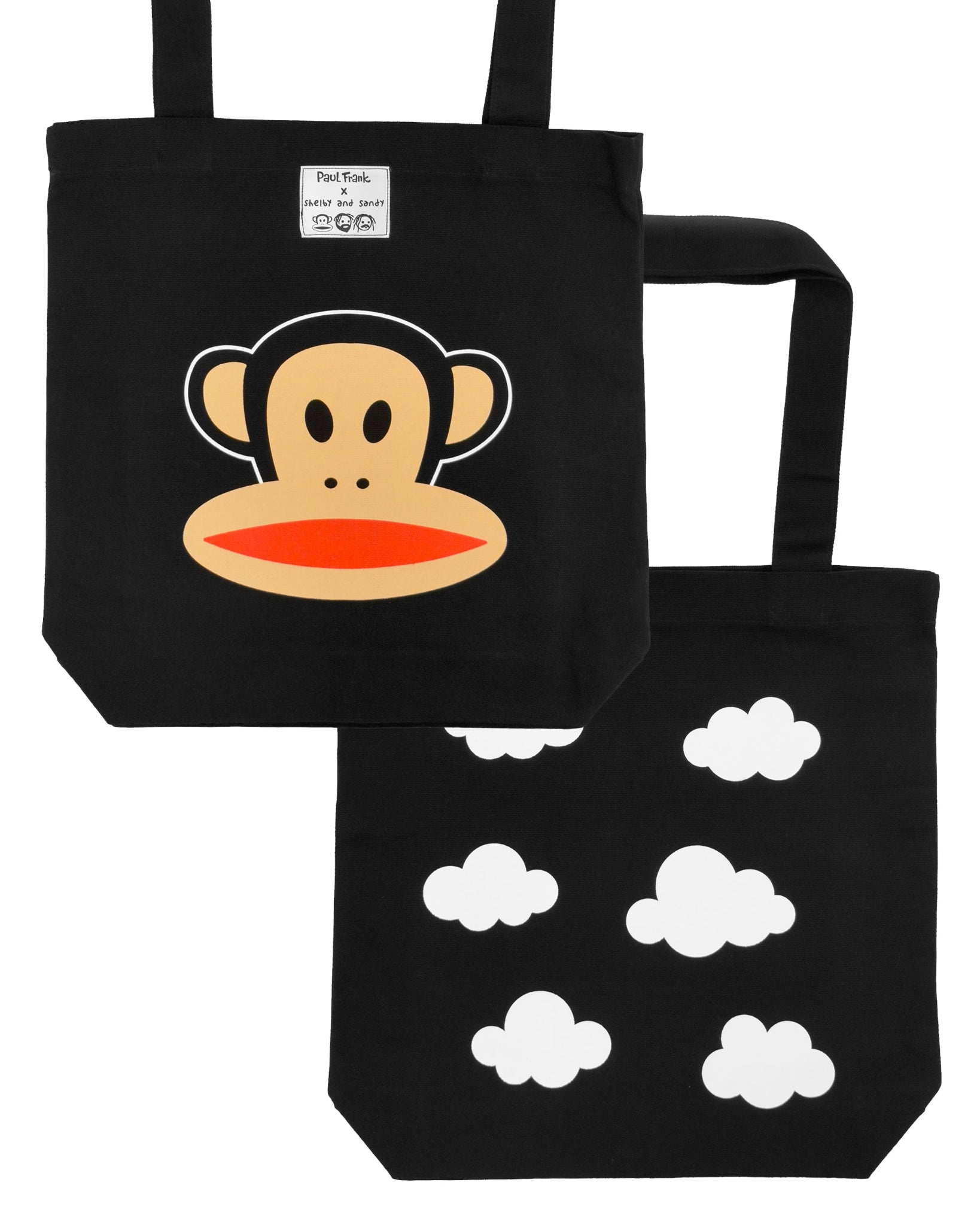 Black tote bag with cartoon monkey face design and a cloud pattern on a back side